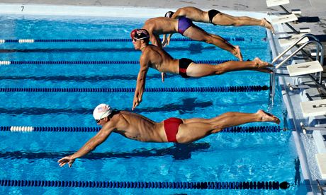 Swimmers starting a race