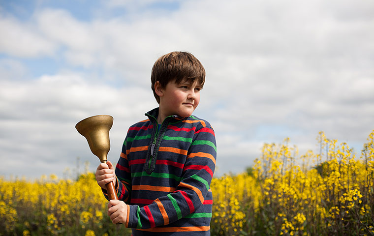 wild food gallery: A young lad with a bell, inexplicably