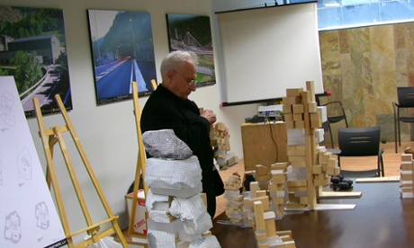 World-weary … Frank Gehry inspects a range of models before his presentation to the jury.