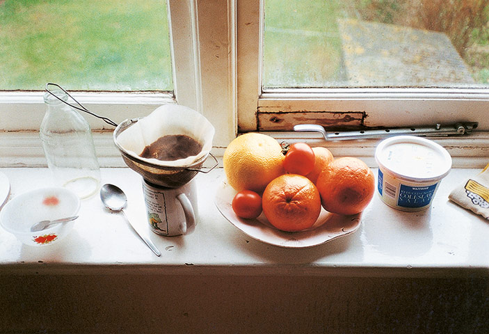 Wolfgang Tillmans: bowl of fruit coffee filter empty milk bottle on window sill