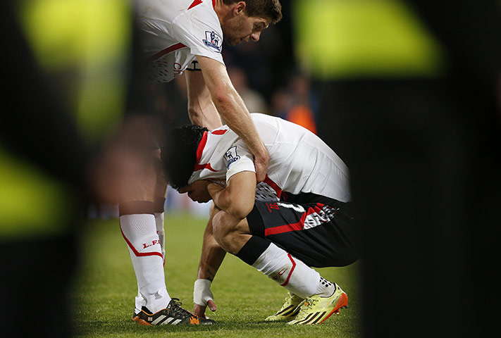 20 Photos: Luis Suárez cries as he is lifted up by Steven Gerrard
