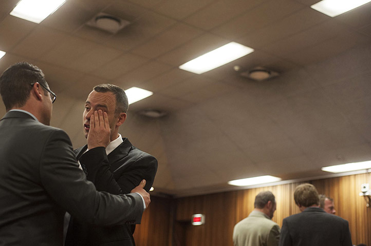 20 Photos: Oscar Pistorius greets his brother Carl in court in Pretoria