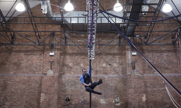 London, UK: A student performing skills on the 'Chinese pole' in the National Centre for Circus Arts.