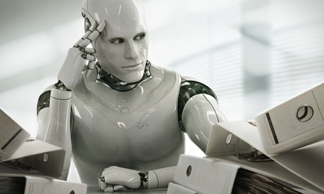 A robot sitting at a desk