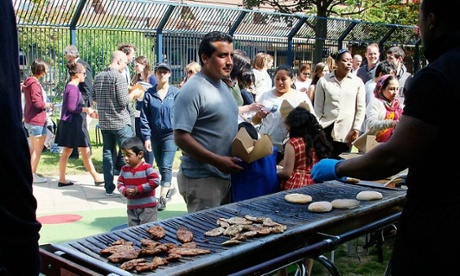 Local residents from Bemerton Villages at a community barbecue on the estate organised by Guardian staff and the management organisation as part of volunteering week.