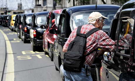 A tourist chats to a cab driver in Parliament Square.