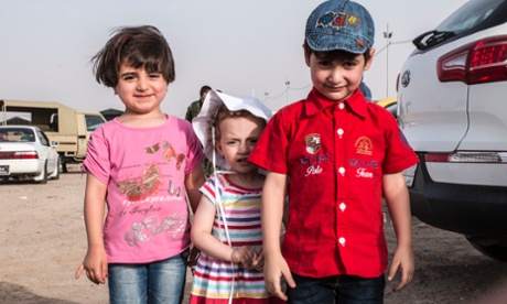Children at a newly made refugee camp near Khazar check point on June 11, 2014 in Mosul, Iraq.  As many as 500,000 people have been forced to flee the Iraqi city of Mosul after hundreds of Islamist militants took control.