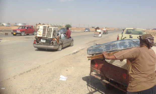 Looting at K1 Iraqi army base, west of Kirkuk. Photograph: Fazel Hawramy for the Guardian
