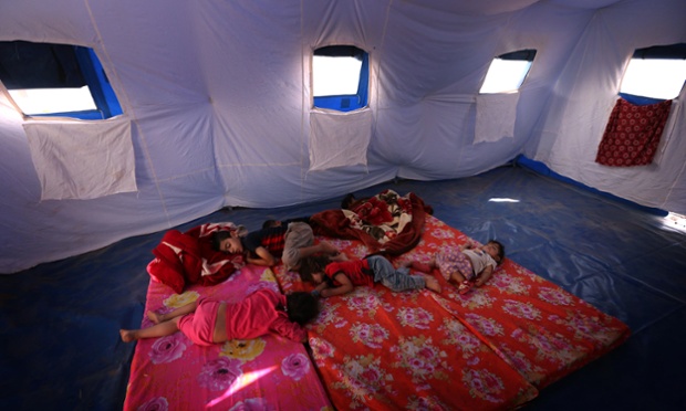 thurs Iraqi children fleeing violence in the northern Nineveh province sleep in a tent at a temporary camp in Aski Kalak, 40 kms West of Arbil, in the  Kurdistan region.