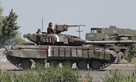 tanks ukraine military russia down plane ukrainian border crossed army after putin rebels vehicles guardian luhansk russian war president brought