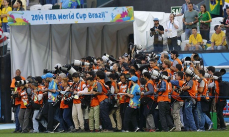 Photographers struggle to get to their positions ready to snap the two teams
