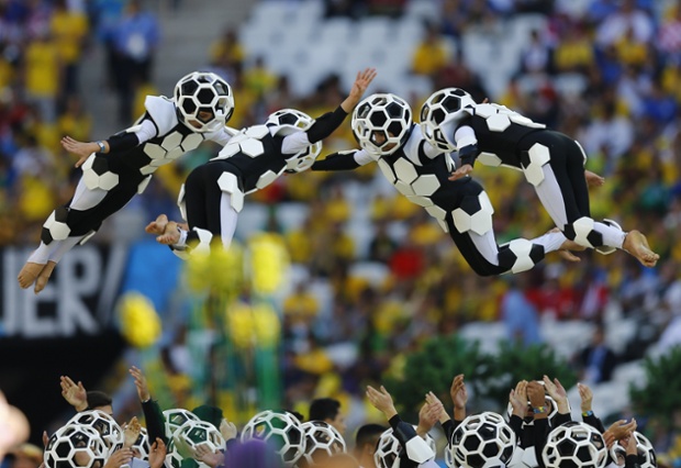 Acrobatic stunts by people dressed as footballs.