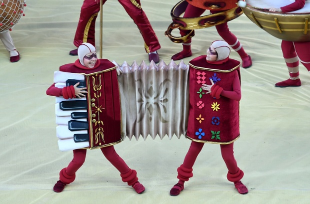 Two people share an accordian outfit
