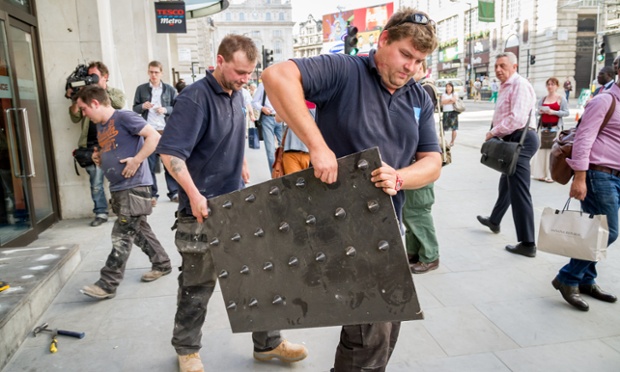 Tesco removes the controversial anti-homeless spikes from outside its Regents Street Metro store in central London just before an organised protest.