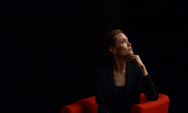 US actress and campaigner, Angelina Jolie, listens during the opening plenary session on the third day of the Global Summit to End Sexual Violence in Conflict in east London on June 12, 2014. Brad Pitt added his A-list support to his partner Angelina Jolie's efforts to eradicate rape in warzones when he joined her in a flashbulb-popping appearance at a global conference in London.