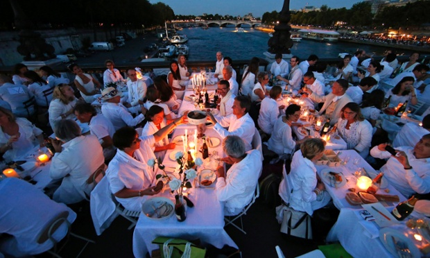 Diners gather at their tables during the Diner en Blanc (Dinner in White) in Paris