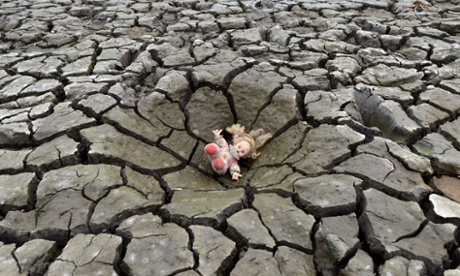 A doll lies on a hole in the dry soil of Los Laureles dam, southern Tegucigalpa, Honduras.