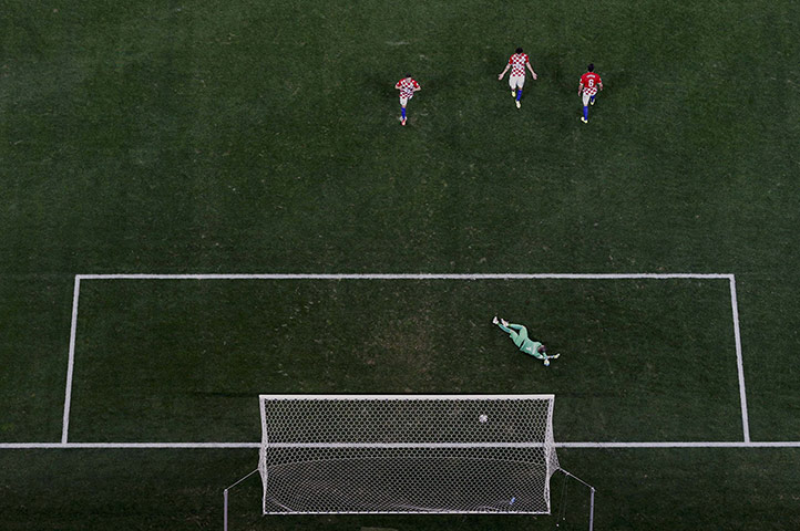 20 Photos: Croatia's players react after conceding the third goal to Brazil's Oscar