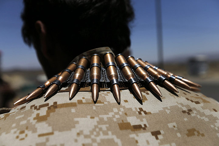20 Photos: A soldier wears a machine gun bullet belt near a prison near Omran