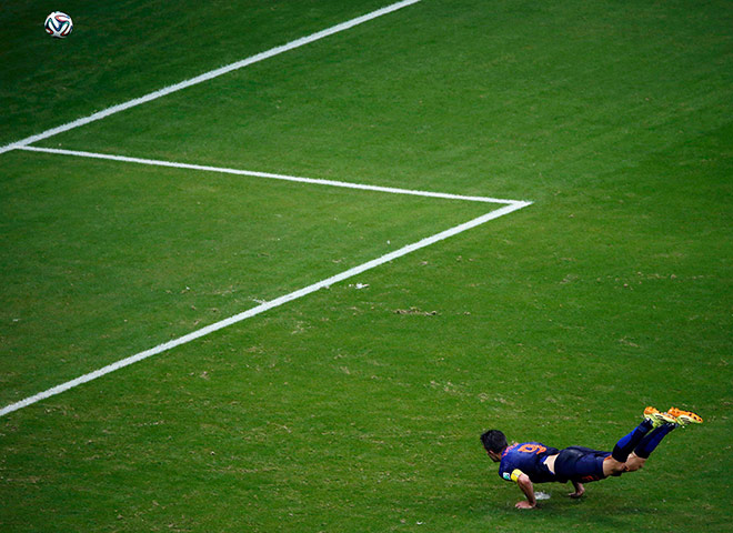 20 Photos: Robin van Persie of the Netherlands heads to score against Spain