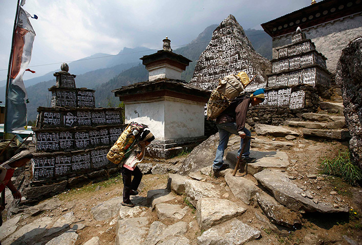 FTA: Ascent to Everest: Kedar Rai, right, 42, and his sons carry goods to their shop in Solukhumbu 