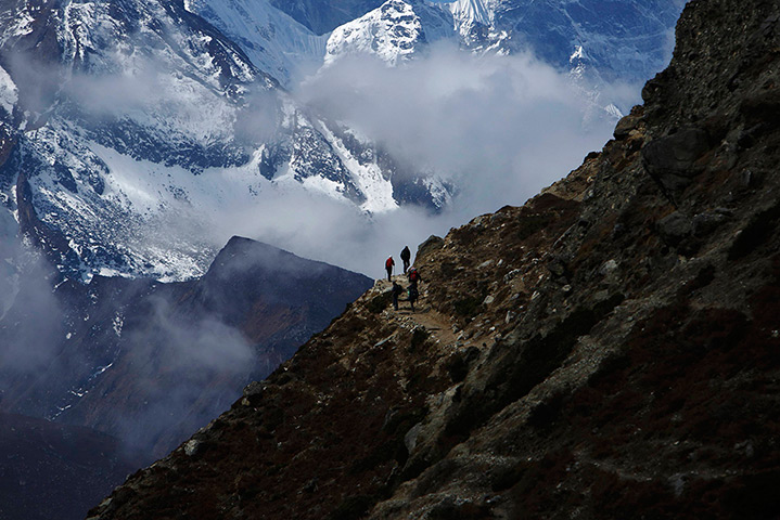 FTA: Ascent to Everest: Trekkers walk in front of Mount Thamserku on their return from Everest base