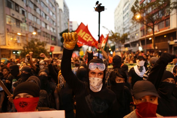 Anti-World Cup demonstrators march near Maracana stadium in Rio