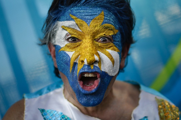 An Argentinian fan cheers outside the Maracana Stadium before the World Cup match between Argentina and Bosnia in Rio