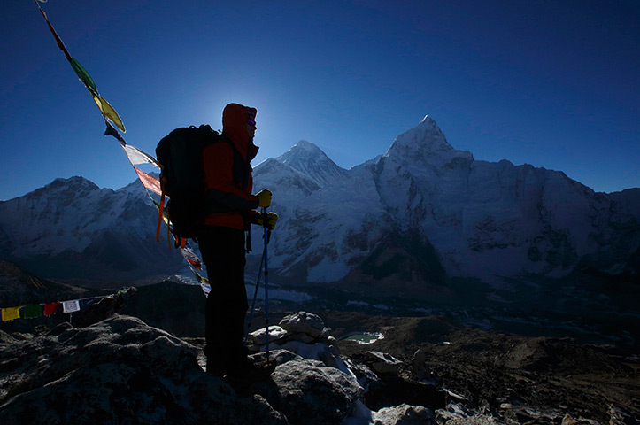 FTA: Ascent to Everest: A trekker stands in front of Mount Everest, 8,850 metres high, at Kala Patt