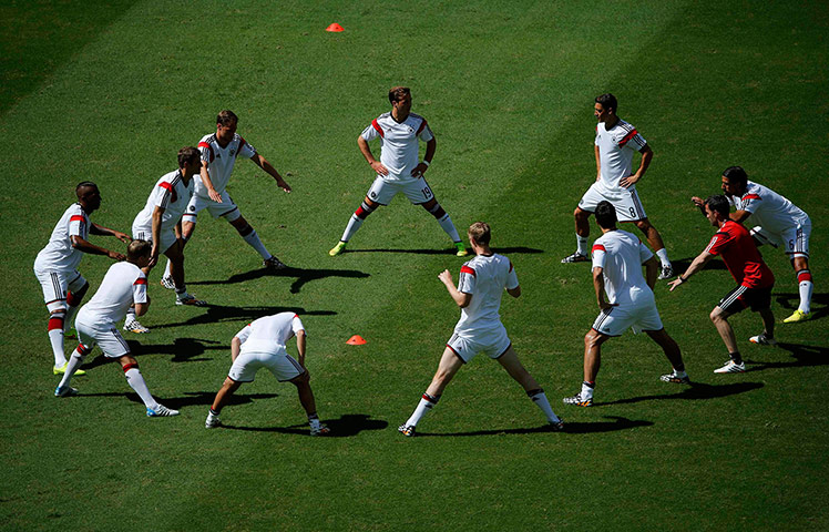 Germany v Portugal: Germany players warm upat the Fonte Nova arena