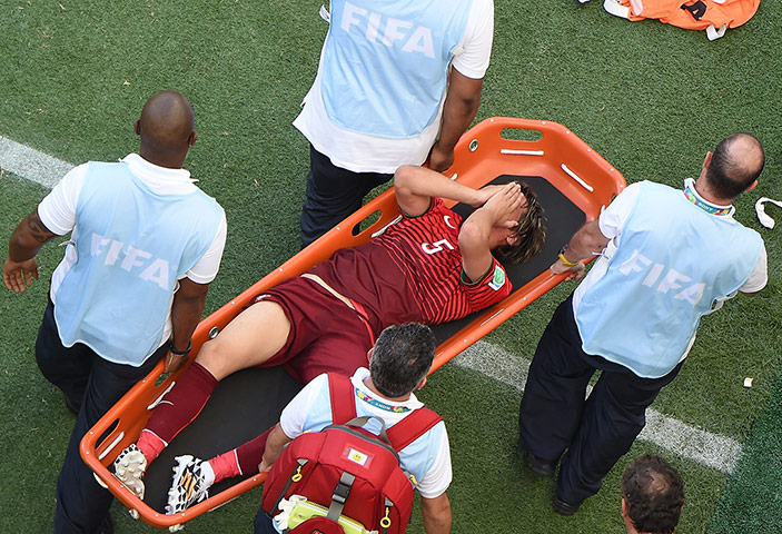 GermanyvPortugal: Portugal's defender Fabio Coentrao (C)  is stretchered off