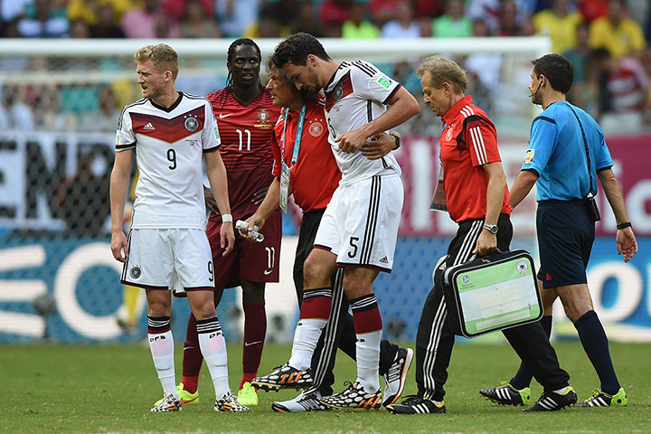 GermanyvPortugal: Mats Hummels joins Fabio Coentrao as he is helped off the pitch
