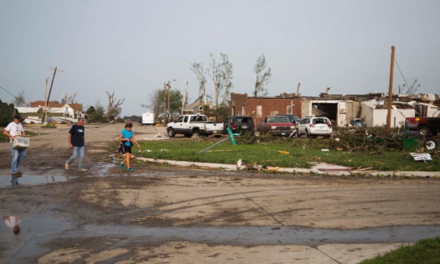 Residents evacuate the town after the tornadoes caused severe damage