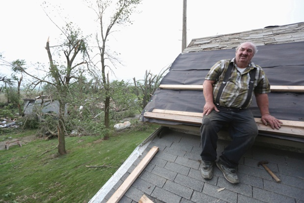 Denis Gentrup, 72, repairs damage to his roof
