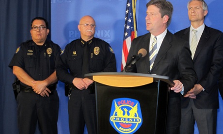 Phoenix Mayor Greg Stanton, second from right, speaks at a news conference announcing the arrest of Gary Michael Moran.