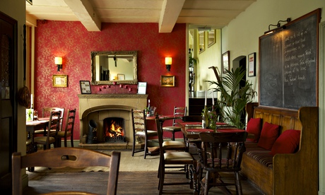 Fireplace, chairs and a pew at the Parkers Arms, in Lancashire