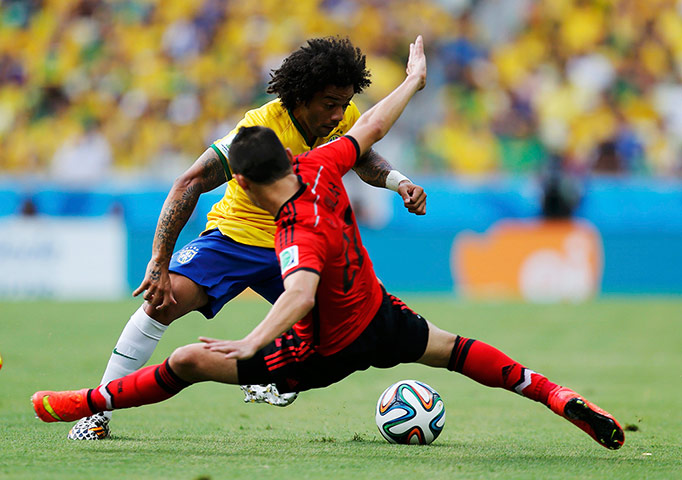 brazil versus mexico: Brazil's Marcelo fights for the ball with Mexico's Aguilar