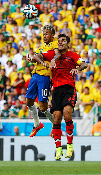 brazil versus mexico: Brazil's Neymar fights for the ball with Mexico's Marquez 