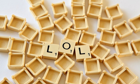 Scrabble tiles / squares spell out LOL , white background studio photograph