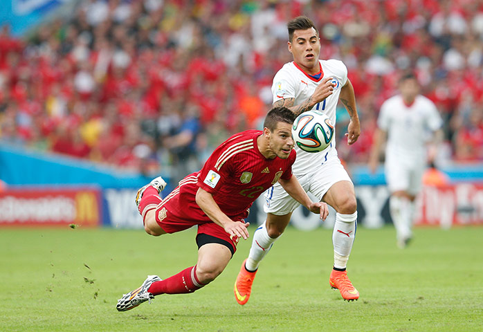 spain v chile : Cesar Azpilicueta gets his head to the ball 