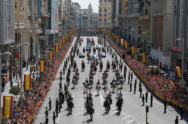 King Felipe VI and his wife Queen Letizia in a parade through the streets of Madrid from the Congress of Deputies to the Royal Palace.