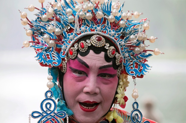 Actors perform short plays inspired by Peking opera at a public park in Beijing