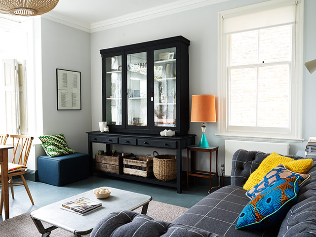 Homes - Keep it Simple: interior of lounge with grey sofa and cabinet 