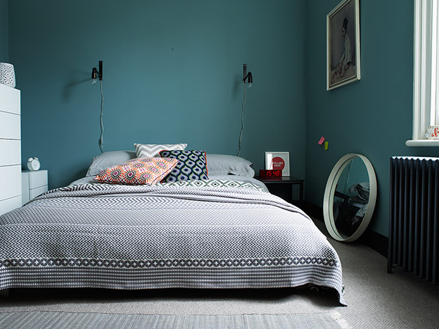 Homes - Keep it Simple: interior of bedroom with blue/green walls and grey floor