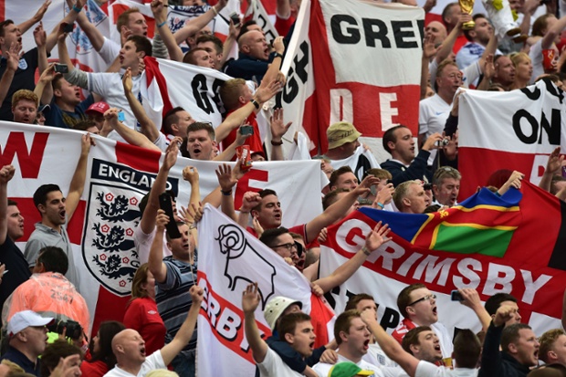 England supporters cheer ahead of the Group D football match between Uruguay and England at the Corinthians Arena in Sao Paulo.