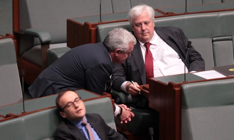 Clive Palmer speaks with Independent Andrew Wilkie during house of representatives question time at Parliament House in Canberra, Monday June, 2, 2014.