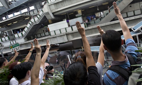 Protesters give the salute in Bangkok, Thailand.