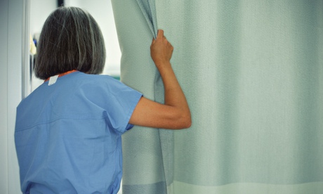 Female doctor opening curtain