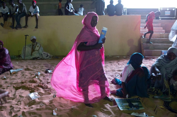 A woman attends a campaign rally for incumbent presidential candidate Mohamed Ould Abdel Aziz in Nouakchott, Mauritania. The country will hold presidential elections tomorrow.