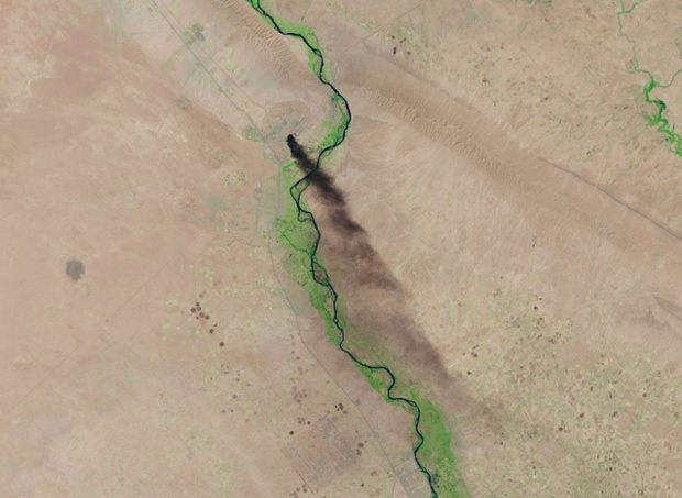 A U.S. Geological Survey satellite image shows smoke rising from the Baiji refinery near Tikrit, Iraq, this week.